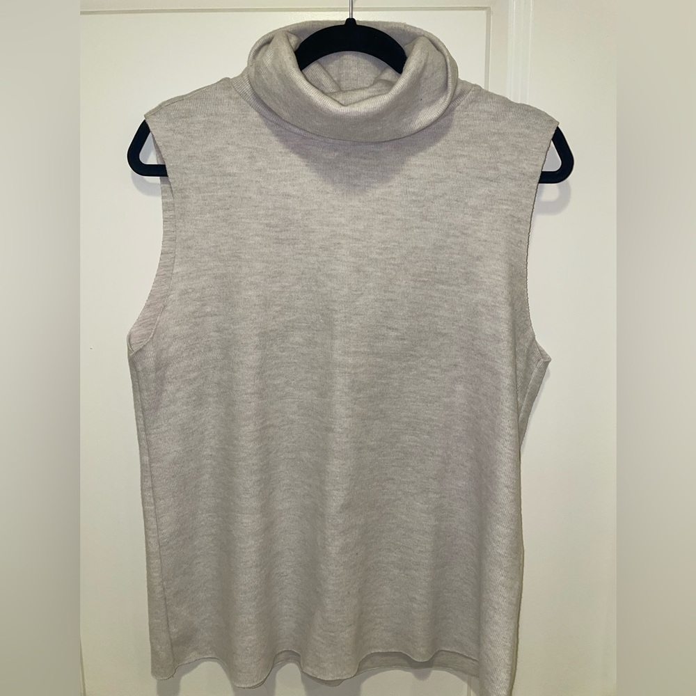 Zara dress in size L, featuring a chic sleeveless turtleneck design.